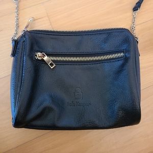 Safe Keeper cross-body black and gold small travel bag purse